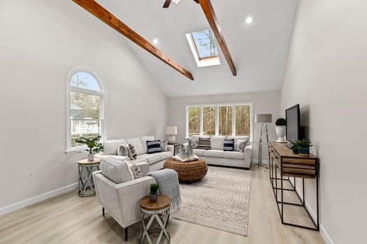 221 Plain Street Hanover, MA 02339 - Photo 5 of 29 a living room with furniture and a flat screen tv