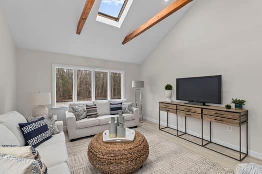 221 Plain Street Hanover, MA 02339 - Photo 6 of 29 a living room with furniture and a flat screen tv