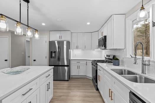 221 Plain Street Hanover, MA 02339 - Photo 9 of 29 a kitchen with refrigerator cabinets and a sink