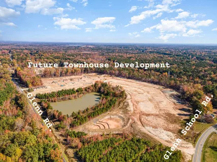 a view of a chairs and table in a backyard