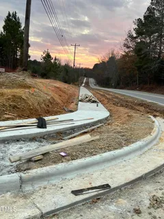 a view of a city street with cars