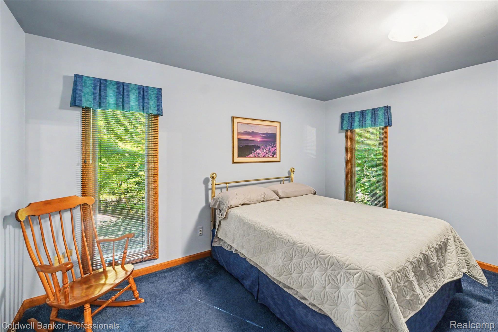 3583 Mitchell Road Metamora, MI 48455 - Photo 39 of 58 Windowed room featuring blue carpeting, light blue wall paint, and white ceiling