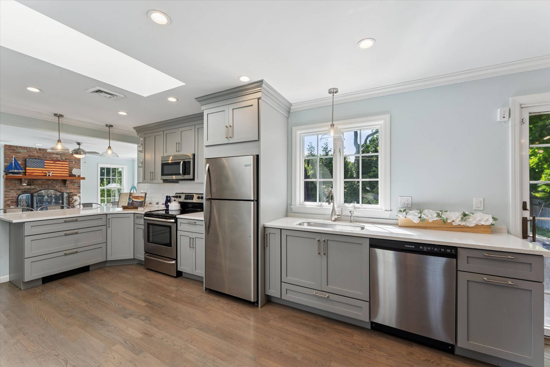 19 Maple Street Westhampton Beach, NY 11978 - Photo 8 of 23 a kitchen that has a sink cabinets stainless steel appliances and windows