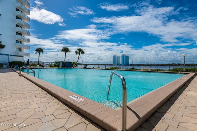 a view of swimming pool with a yard