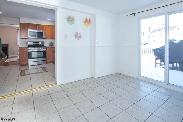 a kitchen with stainless steel appliances a refrigerator and a stove top oven