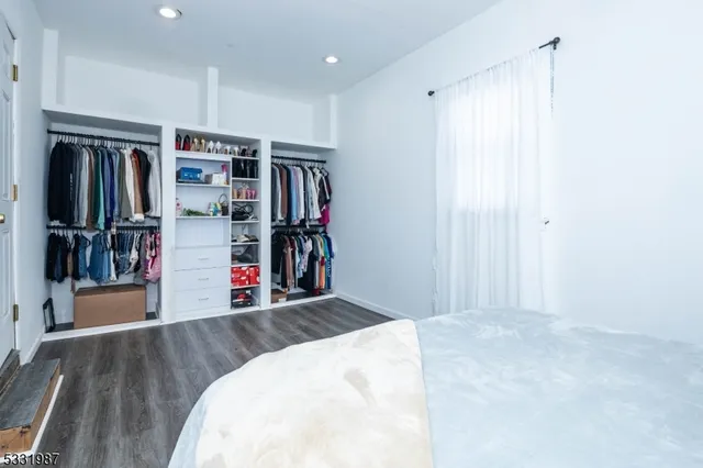 a view of a livingroom with walk in closet and bedroom