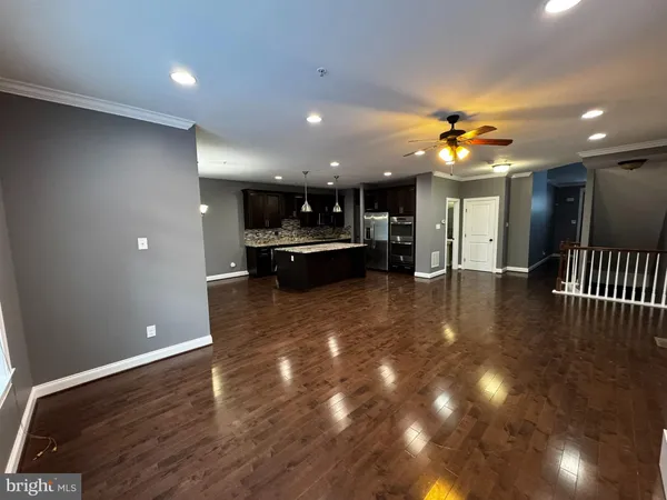 a view of a lobby room with wooden floor