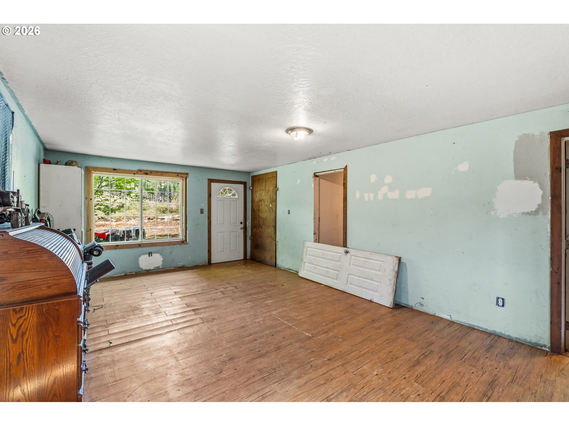 21542 Highway 126 Noti, OR 97461 - Photo 9 of 22 a view of an empty room and window