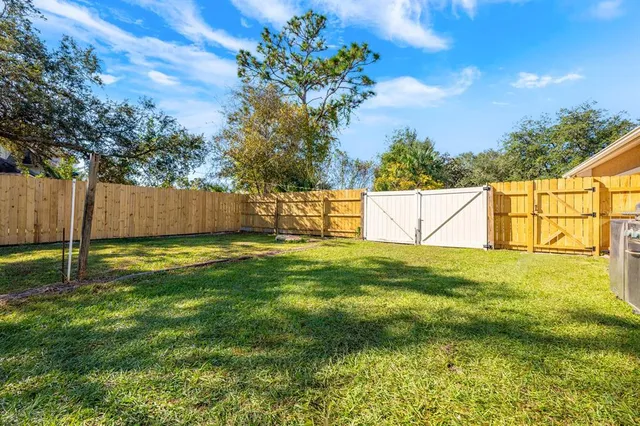 a view of backyard with green space