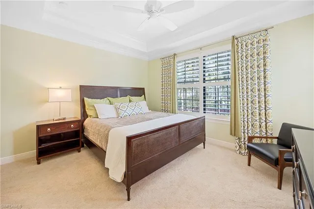 a bed room with a bed and a chair