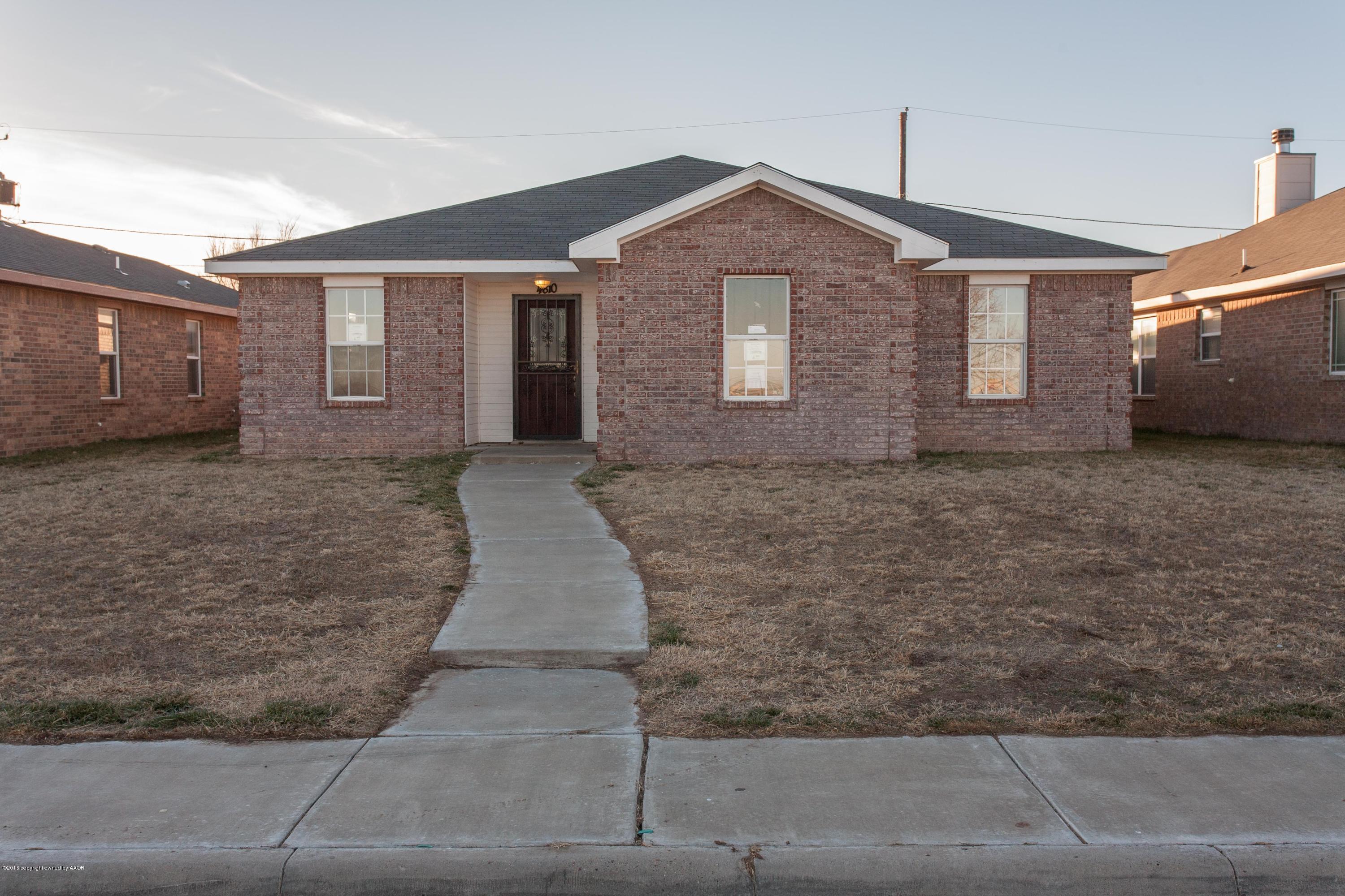 4810 Mammoth Lane Amarillo, TX 79110 - Photo 1 of 14 a front view of a house with a yard