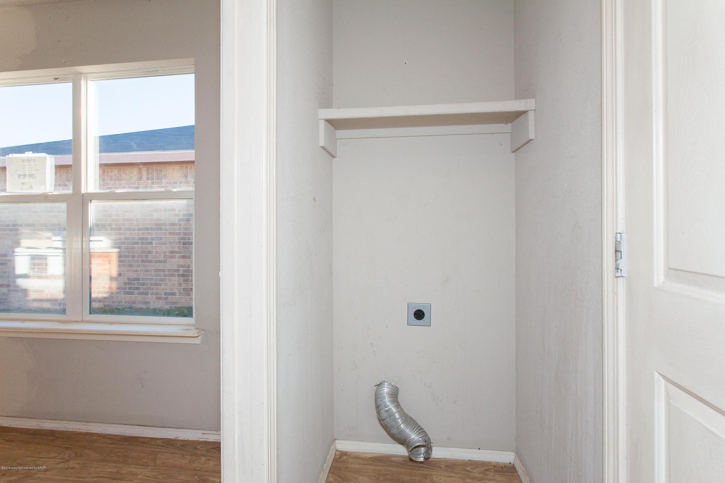 4810 Mammoth Lane Amarillo, TX 79110 - Photo 6 of 14 a view of a small space with wooden floor and a window