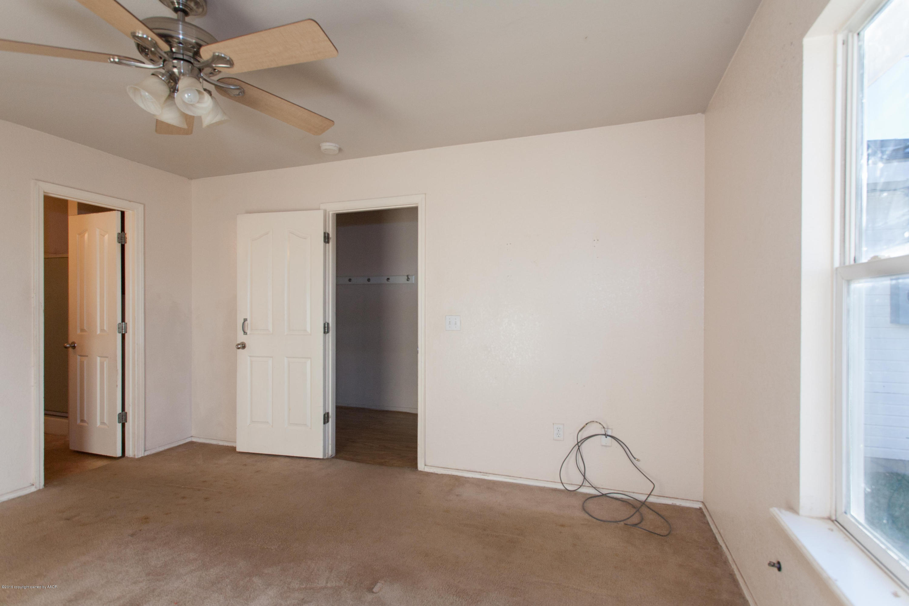4810 Mammoth Lane Amarillo, TX 79110 - Photo 8 of 14 a view of an empty room with a window
