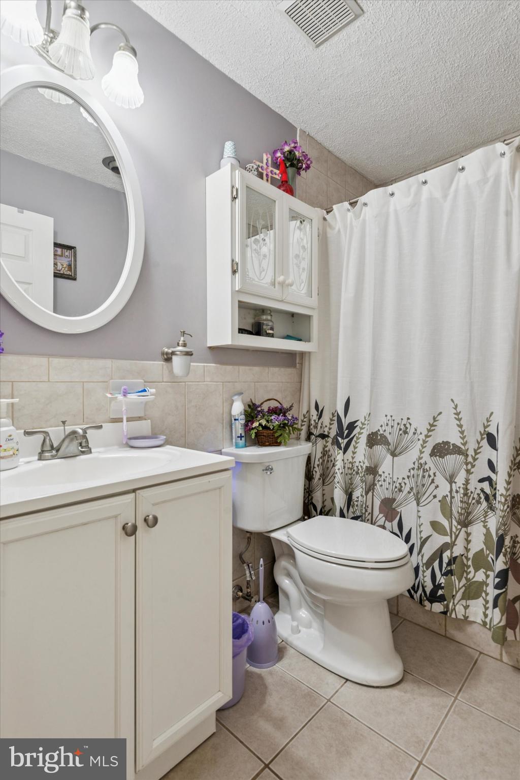 29 Harkfort Road Newark, DE 19702 - Photo 12 of 25 a bathroom with a toilet sink and mirror
