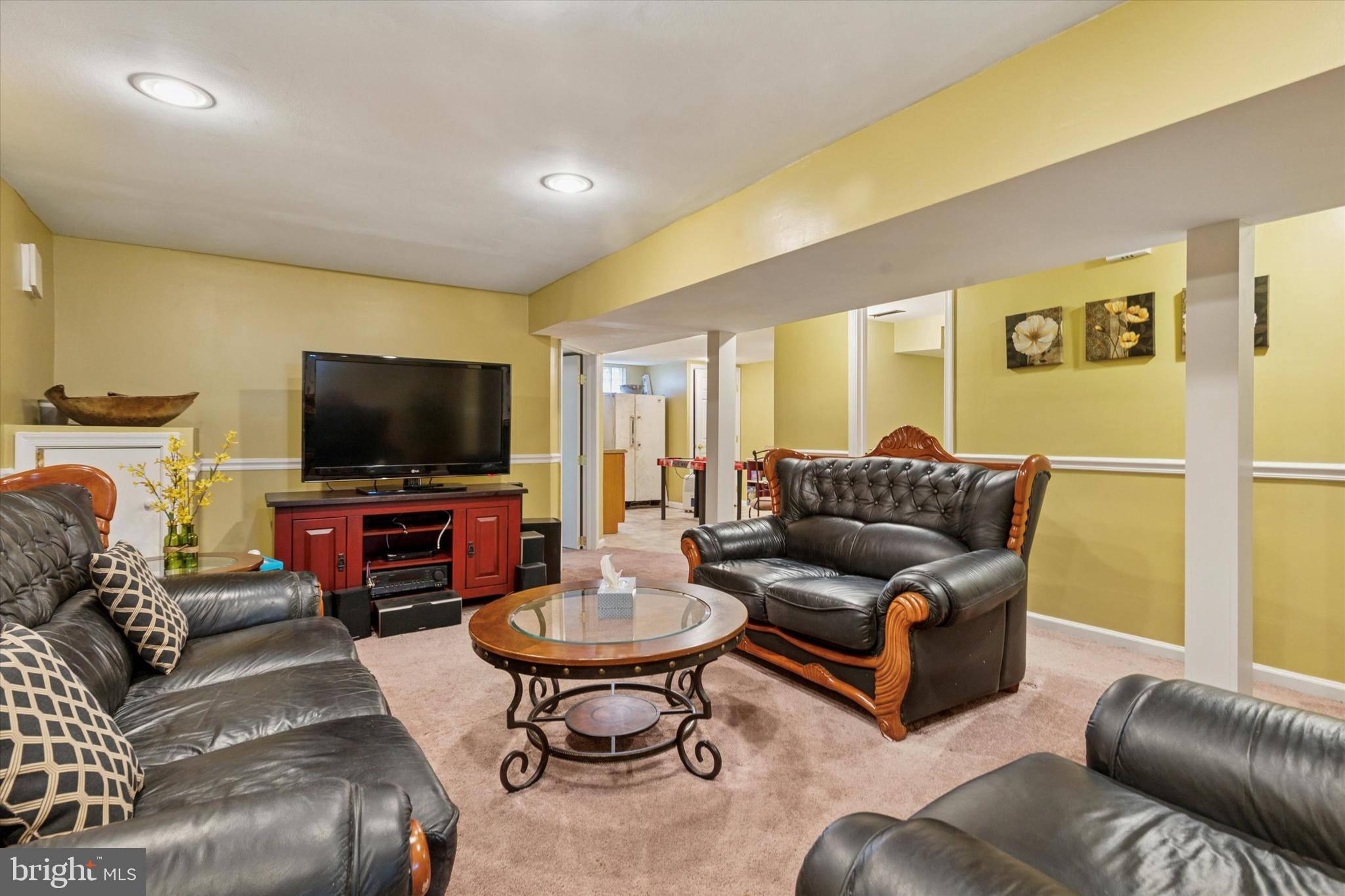 29 Harkfort Road Newark, DE 19702 - Photo 14 of 25 a living room with furniture and a flat screen tv