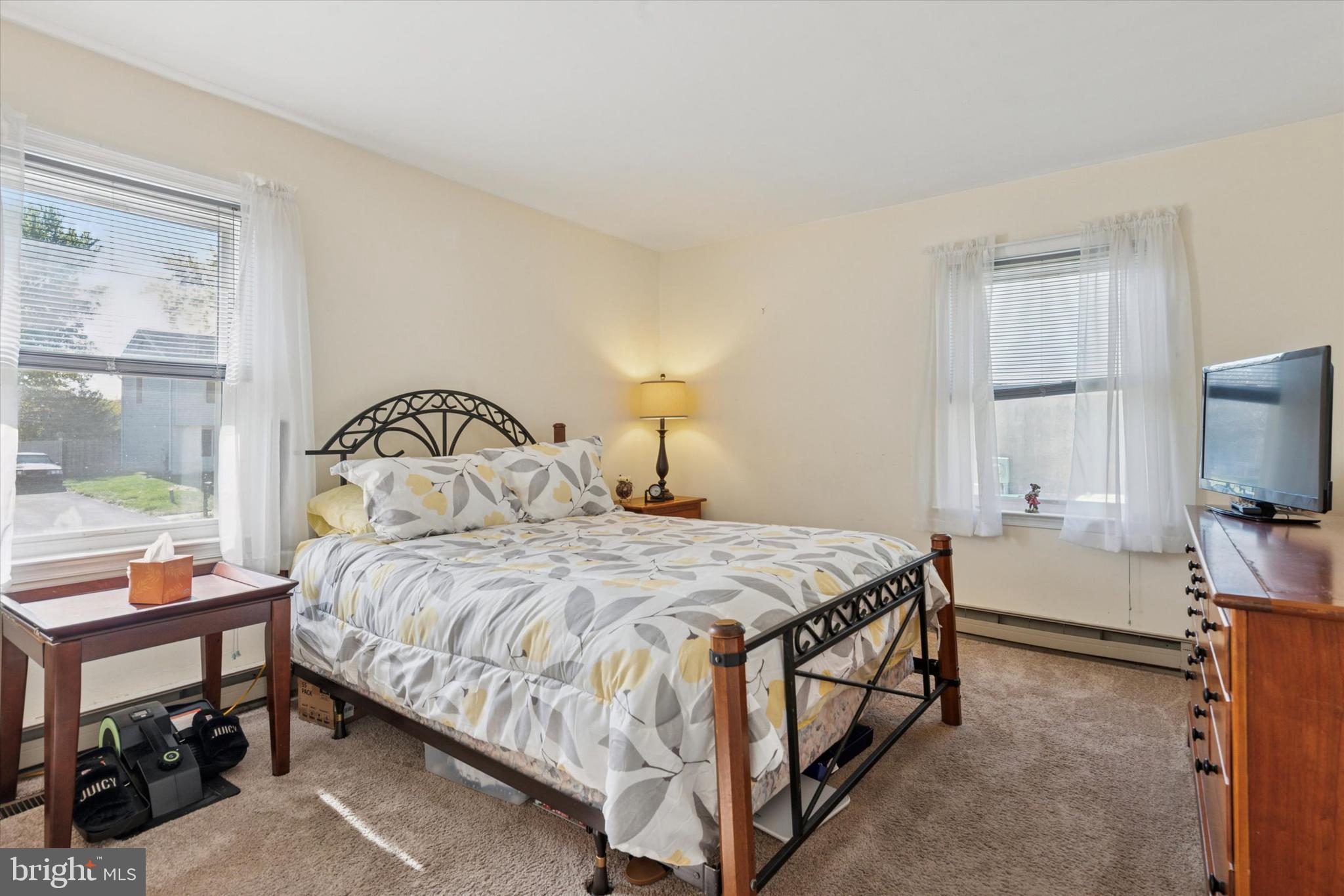 29 Harkfort Road Newark, DE 19702 - Photo 10 of 25 a bedroom with a bed and a flat tv screen on dresser