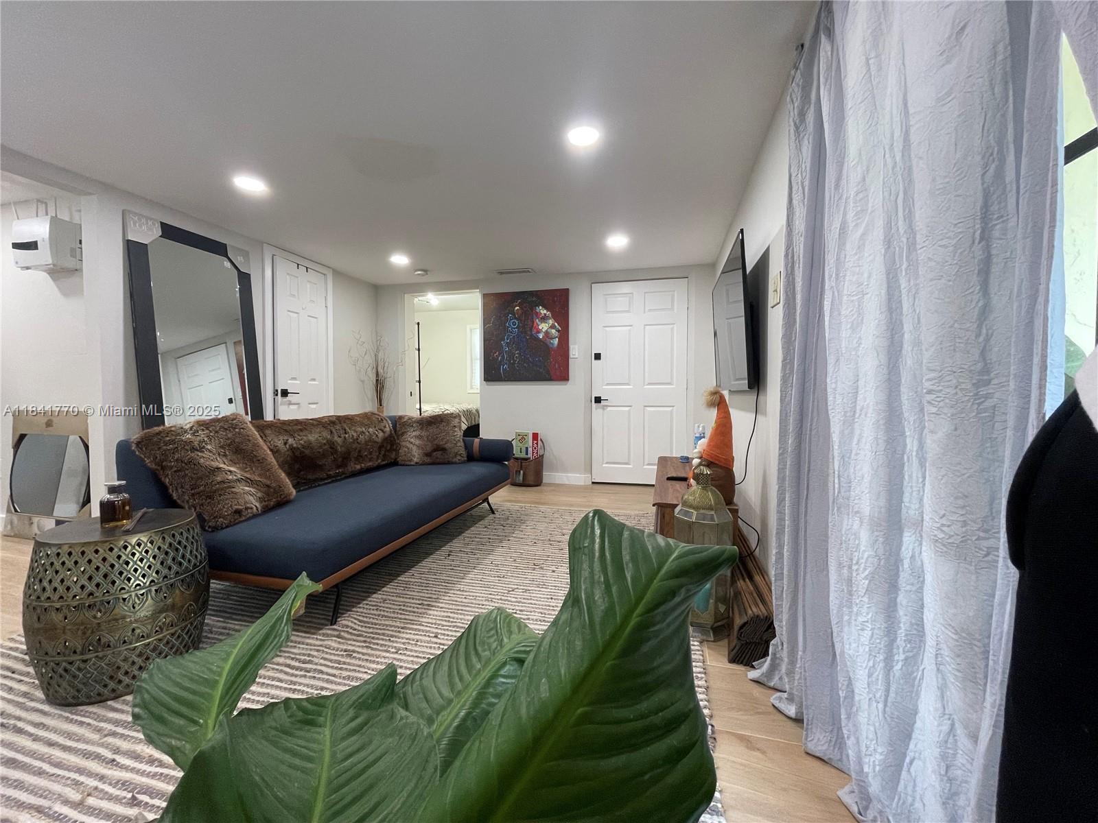 8525 Franjo Road, Unit 2 Cutler Bay, FL 33189 - Photo 7 of 23 a living room with furniture and a flat screen tv