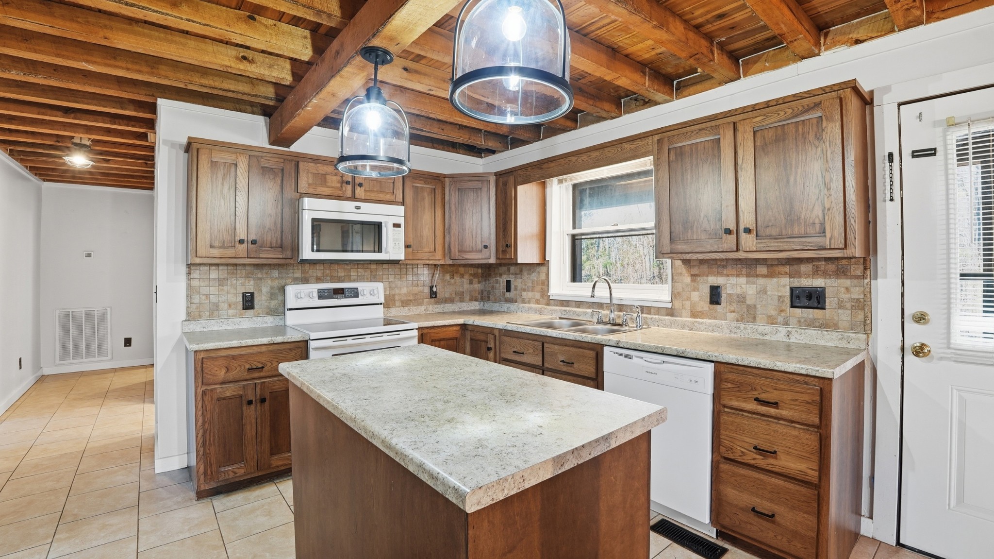 4669 Griffin Road Lynchburg, TN 37352 - Photo 14 of 43 a kitchen with stainless steel appliances granite countertop a stove sink and cabinets