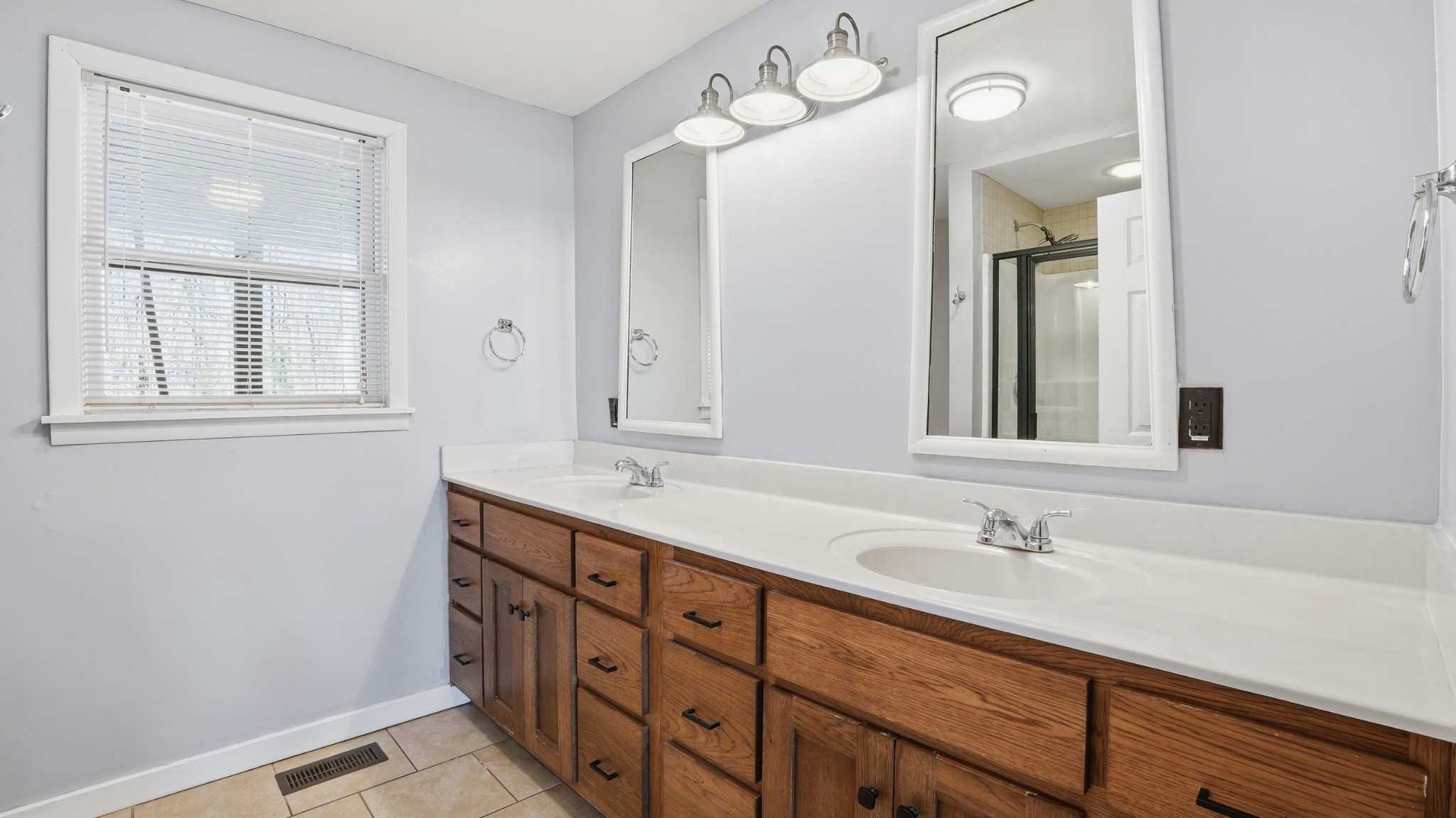 4669 Griffin Road Lynchburg, TN 37352 - Photo 23 of 43 a bathroom with a double vanity sink and a mirror