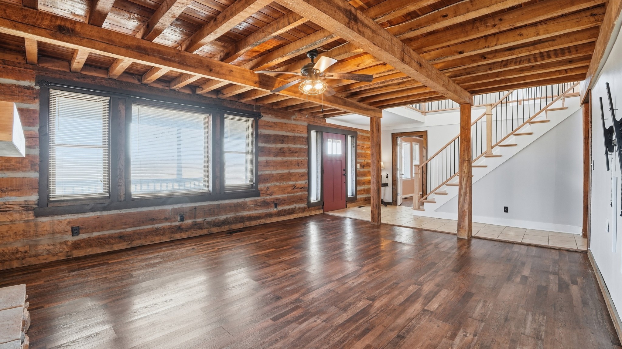 4669 Griffin Road Lynchburg, TN 37352 - Photo 7 of 43 a view of an empty room with wooden floor and windows