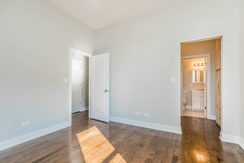 2228 West Cermak Road Chicago, IL 60608 - Photo 14 of 32 a view of an empty room and wooden floor
