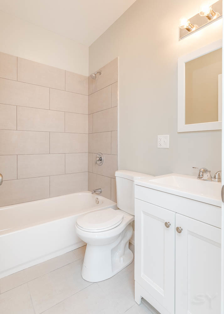 2228 West Cermak Road Chicago, IL 60608 - Photo 27 of 32 a bathroom with a sink toilet and shower