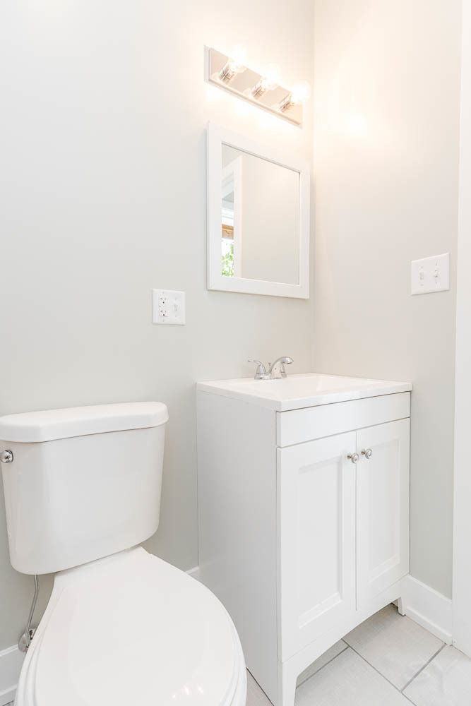 2228 West Cermak Road Chicago, IL 60608 - Photo 29 of 32 a white toilet sitting next to a bathroom sink