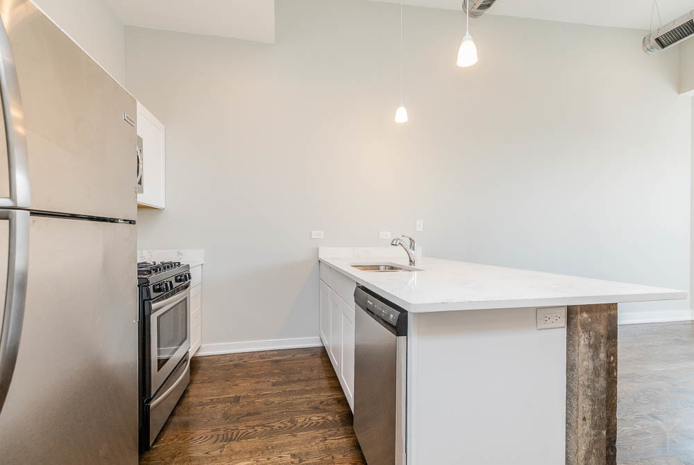 2228 West Cermak Road Chicago, IL 60608 - Photo 5 of 32 a kitchen with a sink a refrigerator and washer