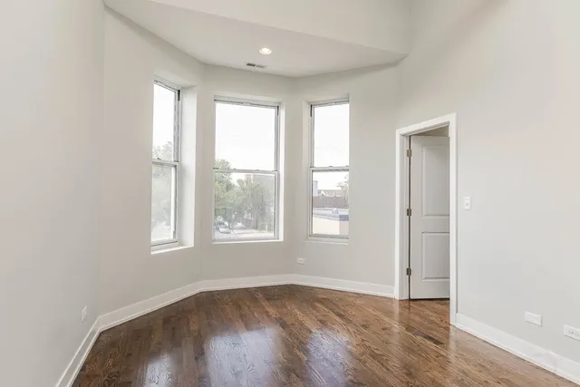 a kitchen with stainless steel appliances a refrigerator and a stove top oven