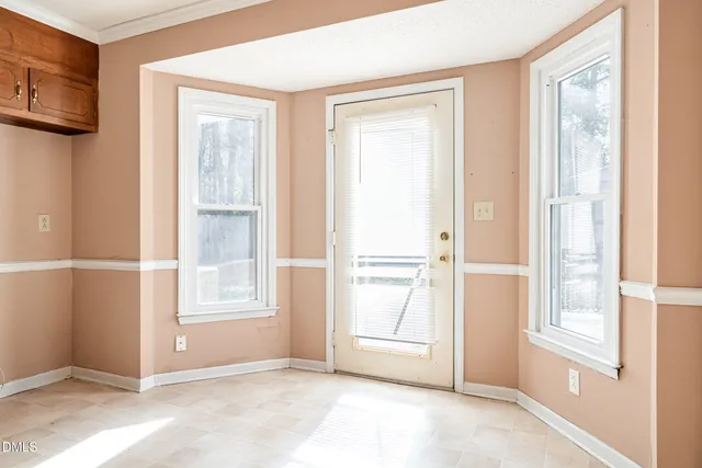 a view of an empty room with a window