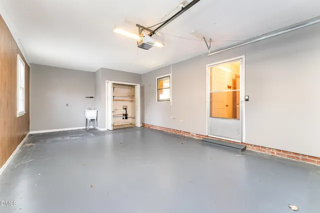 a view of a bathroom with a sink and mirror