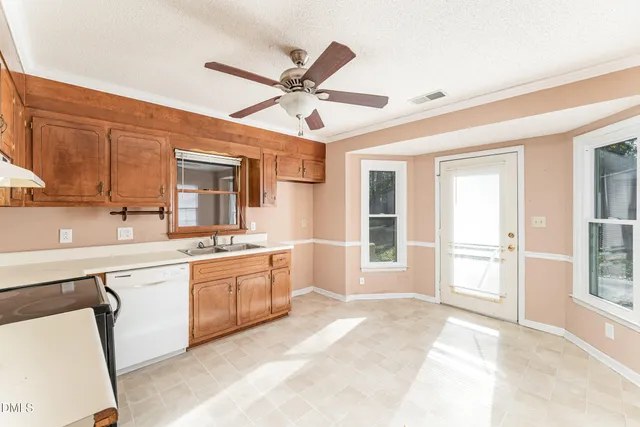 a open kitchen with stainless steel appliances granite countertop a sink and cabinets