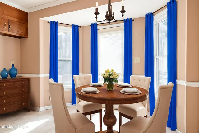 a view of a dining room with furniture and window