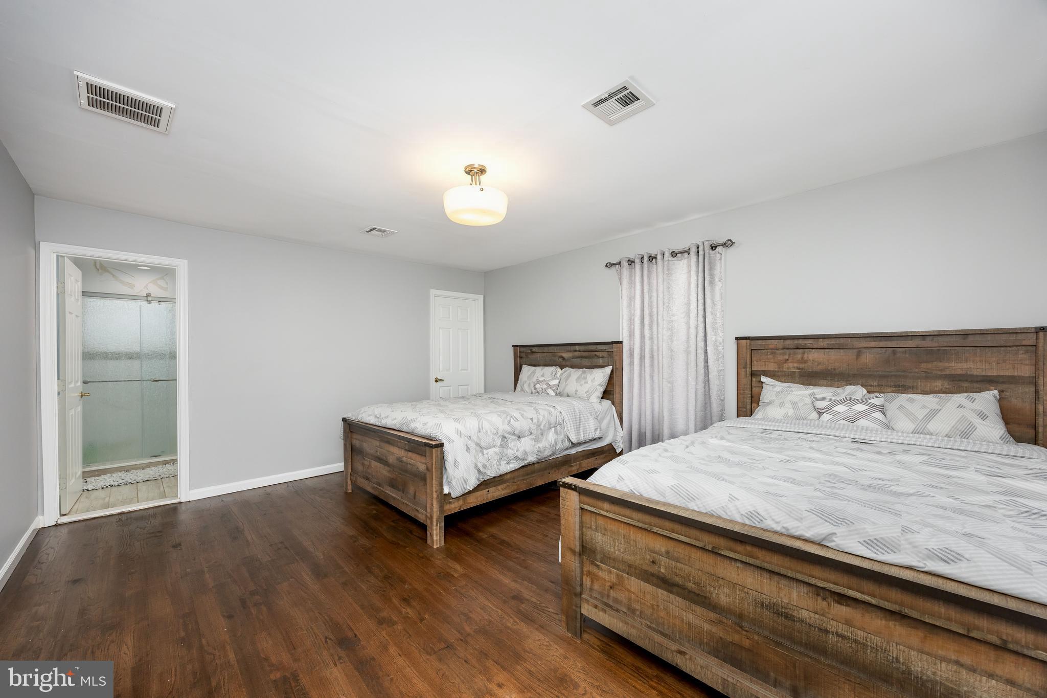 14470 Backbone Road Eden, MD 21822 - Photo 31 of 55 a bedroom with a bed and a chandelier