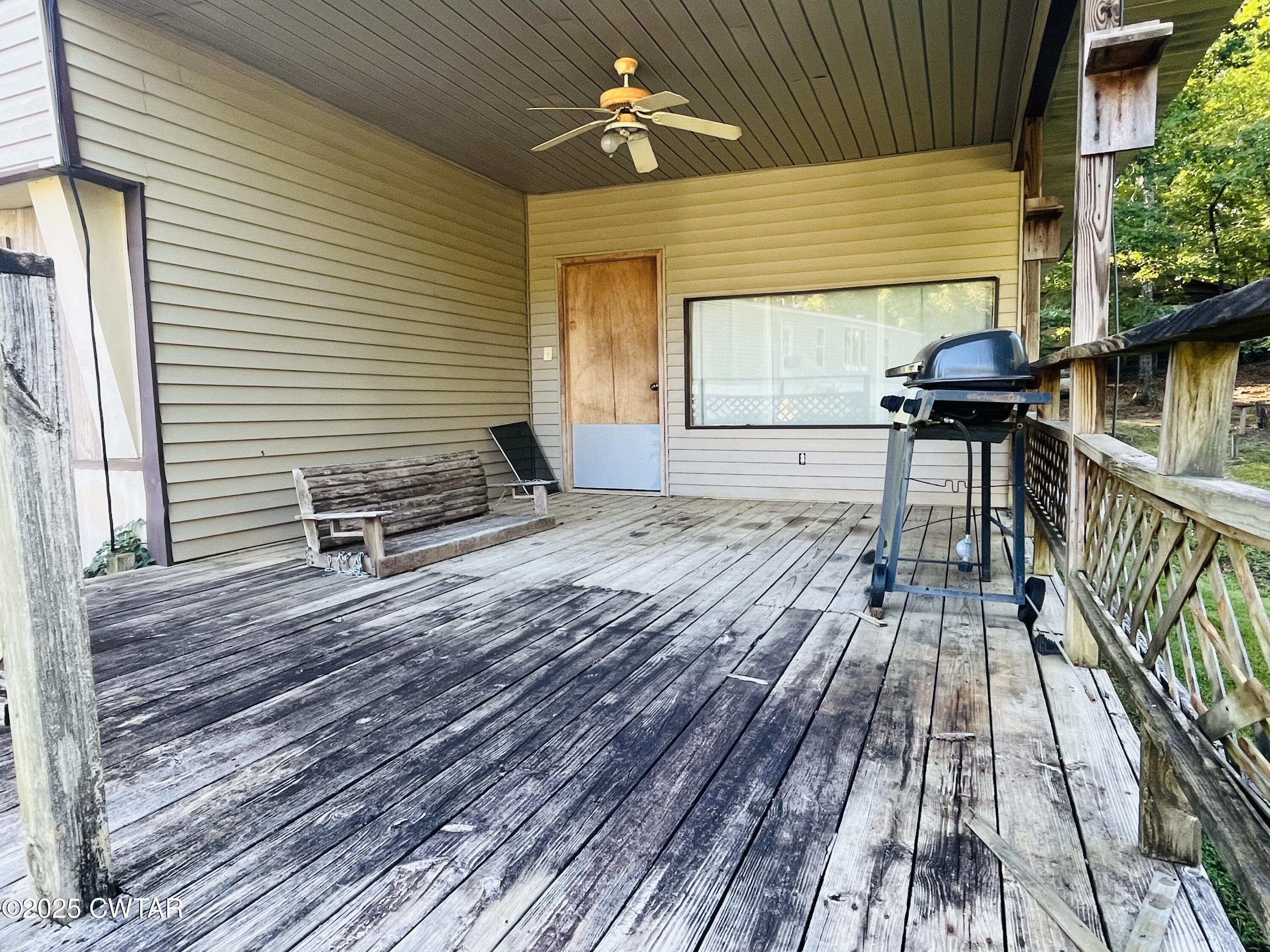 294 Ridgeway Road Sugar Tree, TN 38380 - Photo 12 of 34 a view of a couches with wooden floor