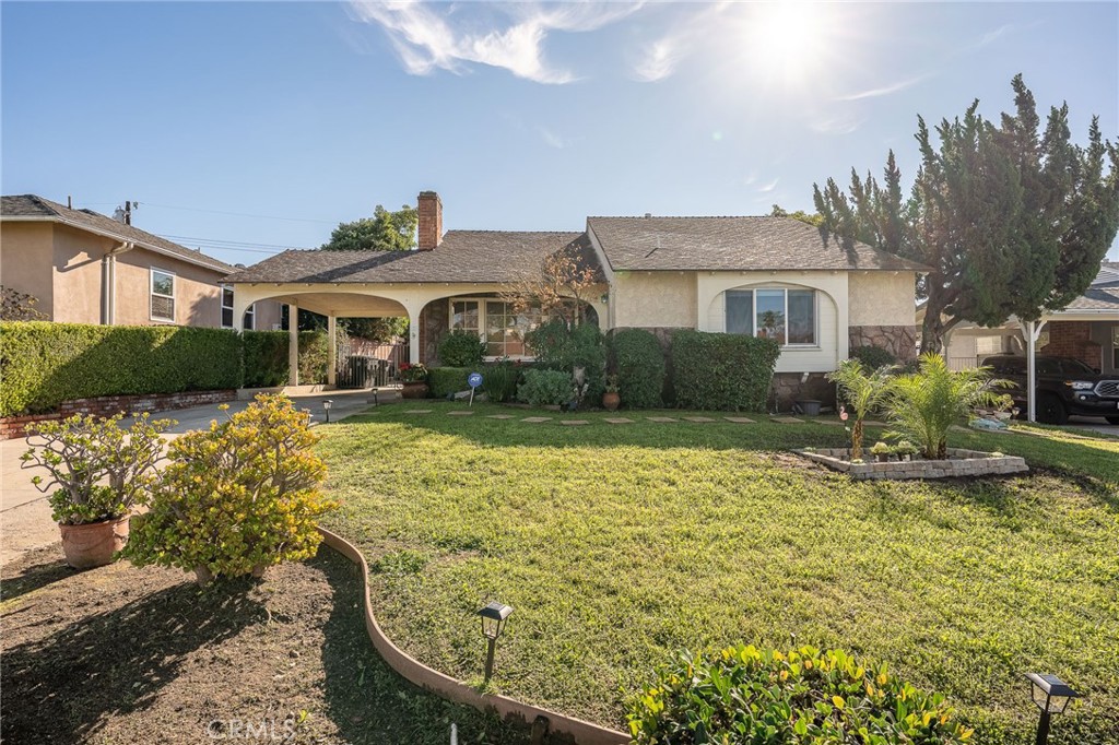 414 University Burbank, CA 91504 - Photo 1 of 18 a front view of a house with garden