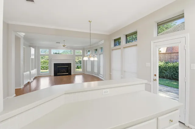 a bathroom with bathtub and window
