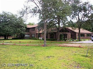 3590 Joe Ashton Road St. Augustine, FL 32092 - Photo 1 of 6 a view of a house with a swimming pool