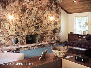 3590 Joe Ashton Road St. Augustine, FL 32092 - Photo 2 of 6 a room with furniture and flat screen tv