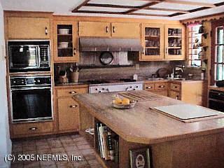 3590 Joe Ashton Road St. Augustine, FL 32092 - Photo 6 of 6 a kitchen with a stove a sink and a refrigerator