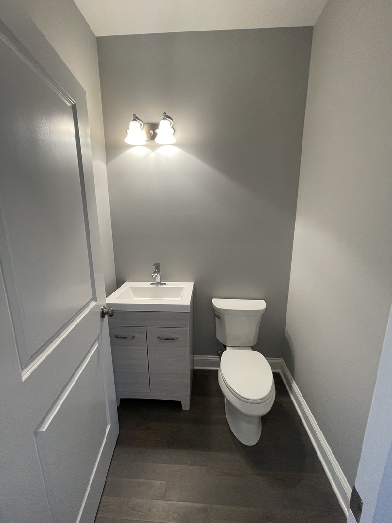 10934 Bryant Road Mokena, IL 60448 - Photo 13 of 24 a bathroom with a toilet sink and mirror