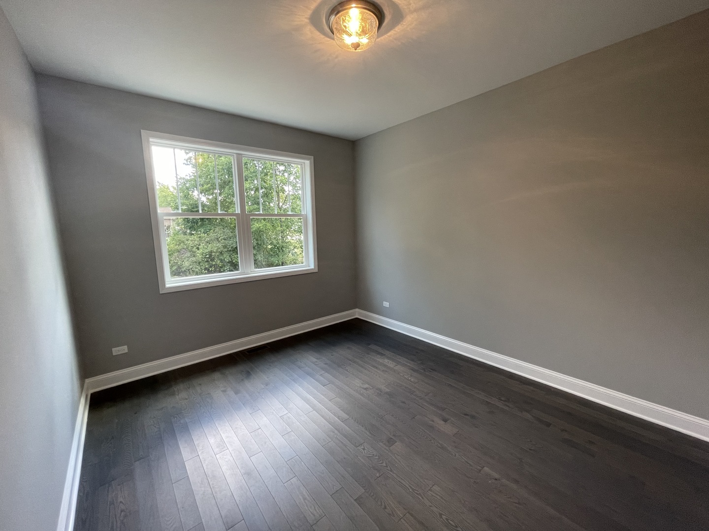 10934 Bryant Road Mokena, IL 60448 - Photo 14 of 24 an empty room with wooden floor and windows