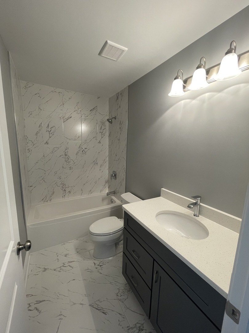 10934 Bryant Road Mokena, IL 60448 - Photo 18 of 24 a bathroom with a sink a toilet and shower