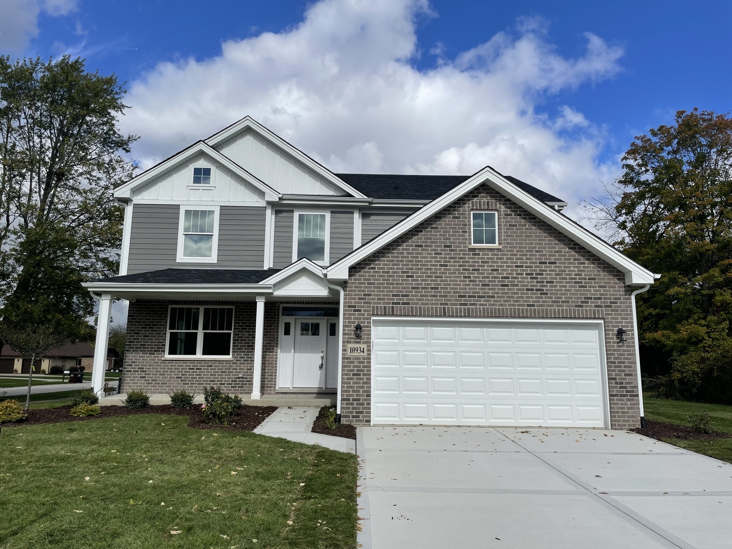 10934 Bryant Road Mokena, IL 60448 - Photo 3 of 24 a front view of a house with a garden