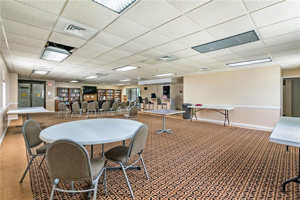 5600 Munhall Road, Unit 606 Pittsburgh, PA 15217 - Photo 14 of 19 a living room with dining room and wooden floor