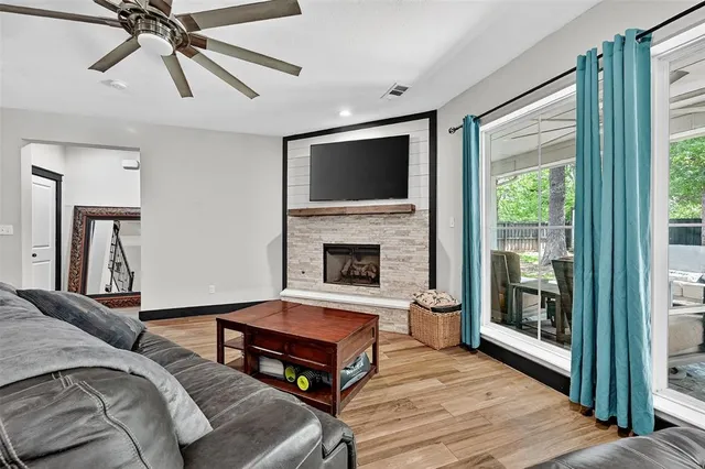 a living room with furniture and a fireplace
