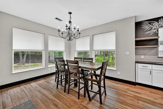 a spacious bedroom with a bed and a large window