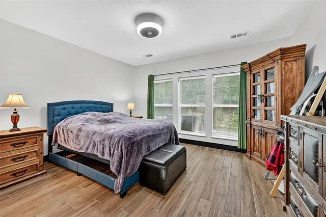 a bed room with a bed and a window