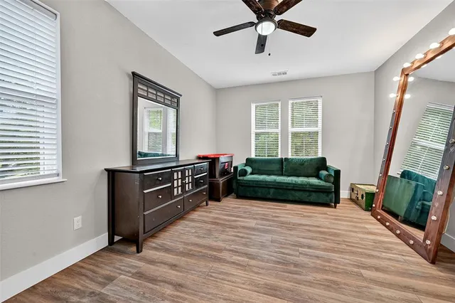 a room with furniture and a book shelf