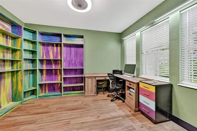 a view of livingroom with furniture and workspace